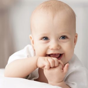 Baby looking forward smiling